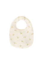 Bavette en coton biologique et élasthanne à motif chiot Honey espiègle avec dos en tissu éponge pour les repas de bébé