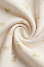 Bavette en coton biologique et élasthanne à motif chiot Honey espiègle avec dos en tissu éponge pour les repas de bébé